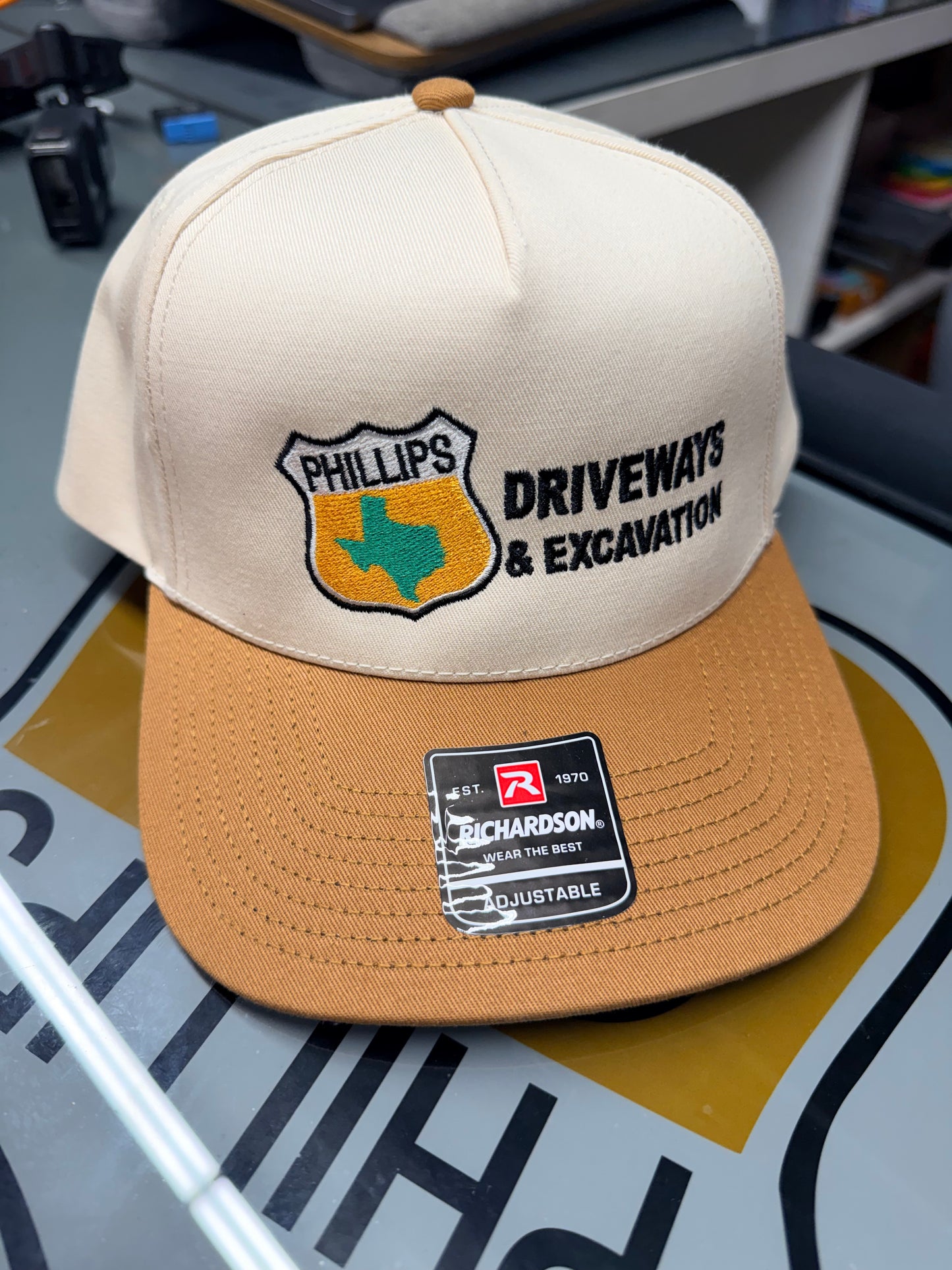 Special Edition Phillips Driveways Hat | cream top with a bold Texas gold bill